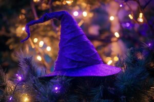 Glowing Witch Hats Hanging from Trees
